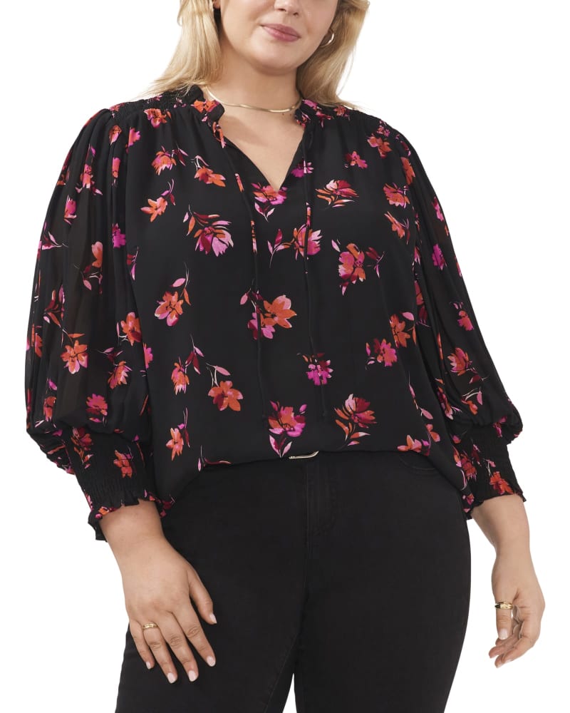 Front of a model wearing a size 1X Larissa Smocked Top in POM PINK by Vince Camuto. | dia_product_style_image_id:261148